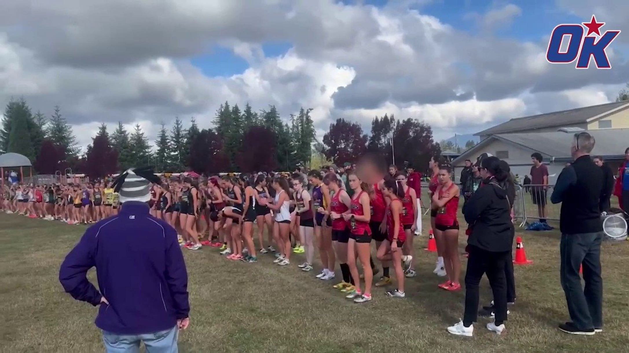 Biological male warms up before race against girls at cross country meet