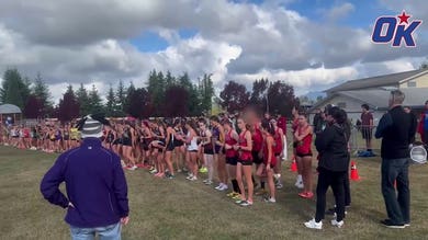 Biological male warms up before race against girls at cross country meet