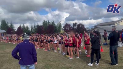 Biological male warms up before race against girls at cross country meet