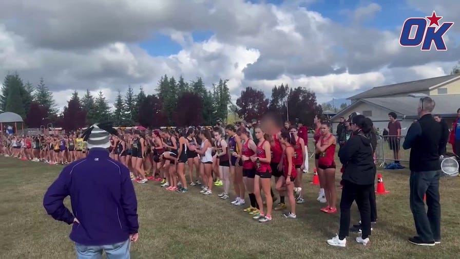 Biological male warms up before race against girls at cross country meet