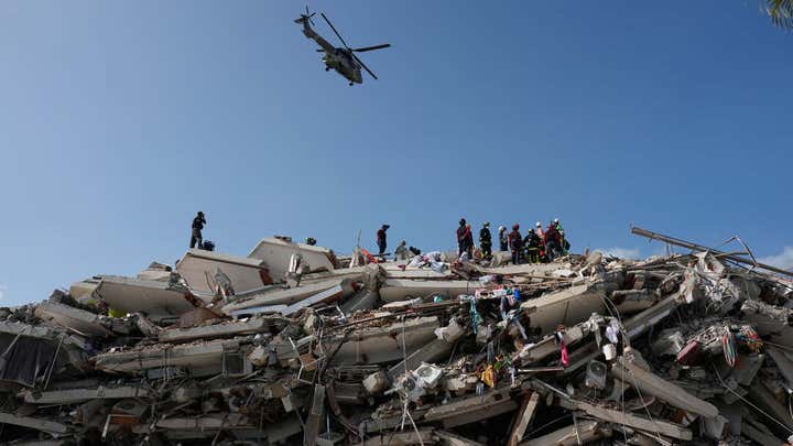 American rescuers pull infant from earthquake rubble in Venezuela