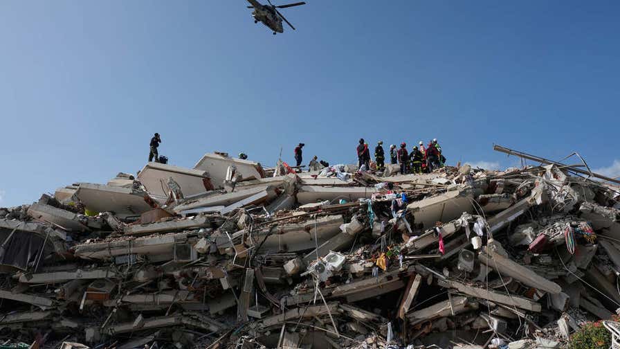 American rescuers pull infant from earthquake rubble in Venezuela