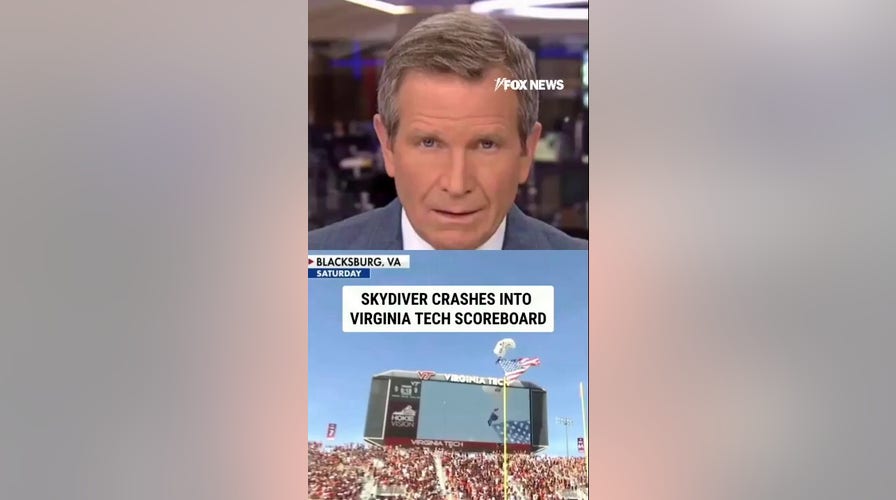 SEE IT: Skydiver CRASHES into Virginia Tech scoreboard