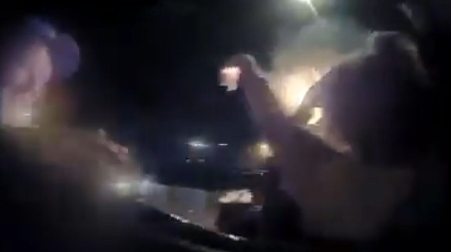 Police officers, good Samaritans pull woman from burning vehicle