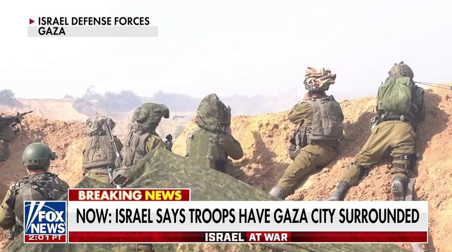 Israel says troops have Gaza City surrounded