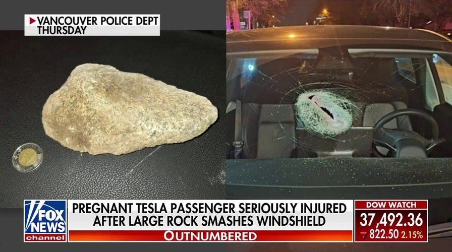 Pregnant Tesla passenger 'seriously injured' after large rock smashes windshield