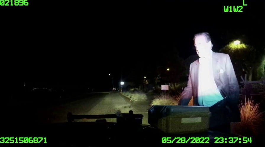 Paul Pelosi speaks with police officers administering DUI test