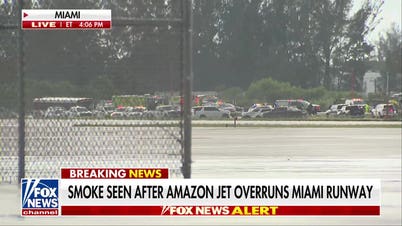 Amazon cargo jet overruns runway at Miami airport, strikes multiple vehicles