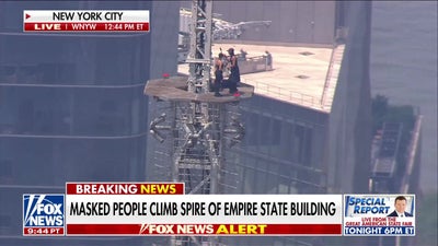 Masked man proposes to woman on Empire State Building spire