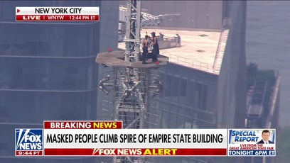 Masked man proposes to woman on Empire State Building spire