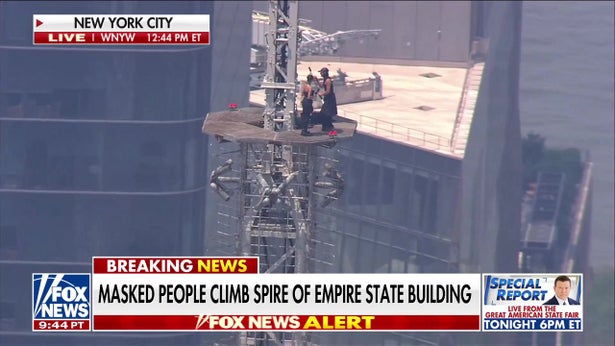 Masked man proposes to woman on Empire State Building spire