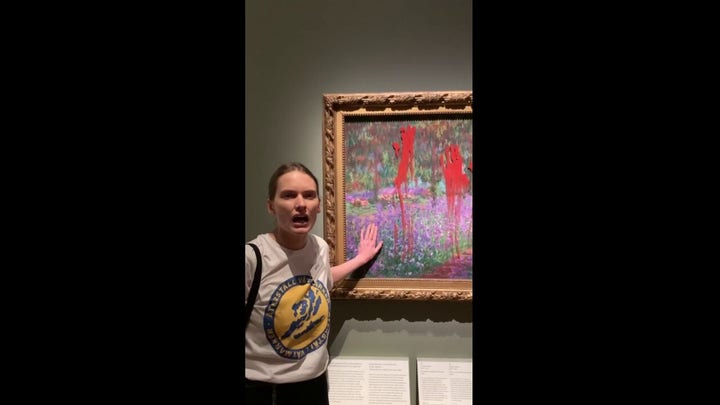 Swedish environmental protesters glue their hands to Monet painting, smear red paint to protest climate change