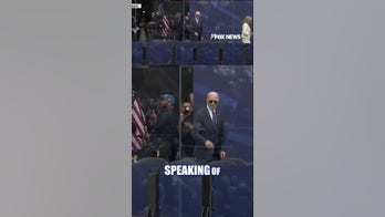 Joe Biden stands alone as Obama, Jill Biden exit stage