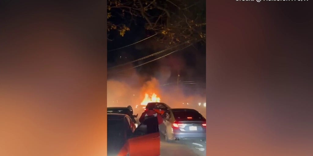 Wild footage shows a car set ablaze during a neighborhood street takeover in New York City