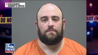 Armed man arrested after lunging at Democratic candidate Amy Acton