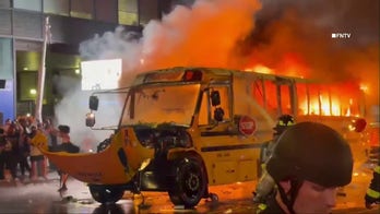 School bus engulfed in flames on 42nd Street as Knicks fans celebrate