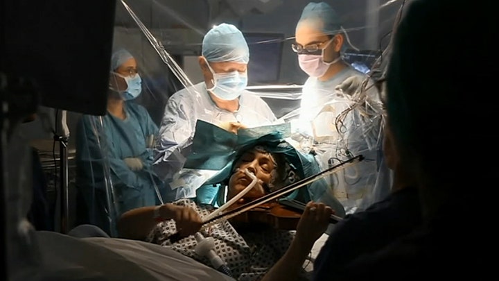 Patient plays violin while surgeons remove brain tumor