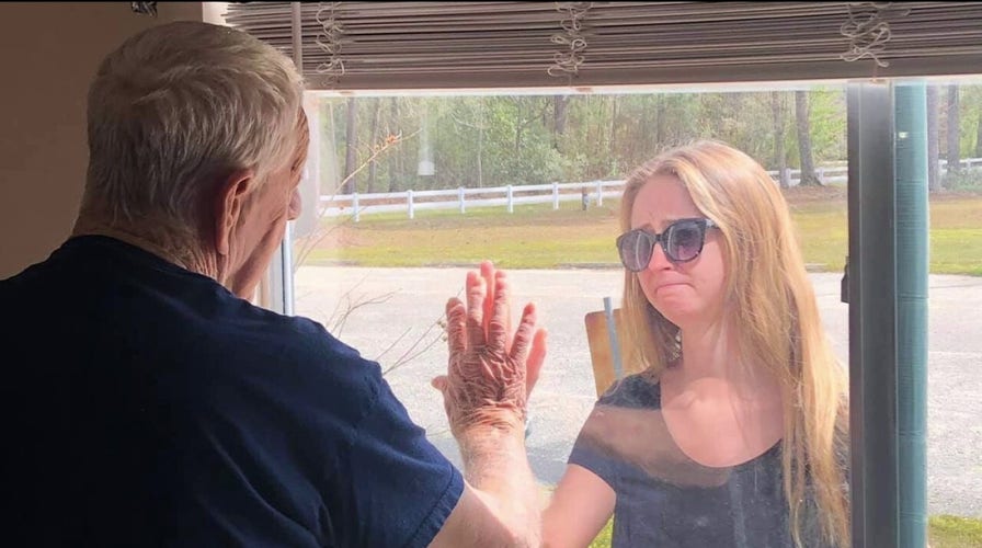 North Carolina woman shares engagement news with grandfather through nursing home window