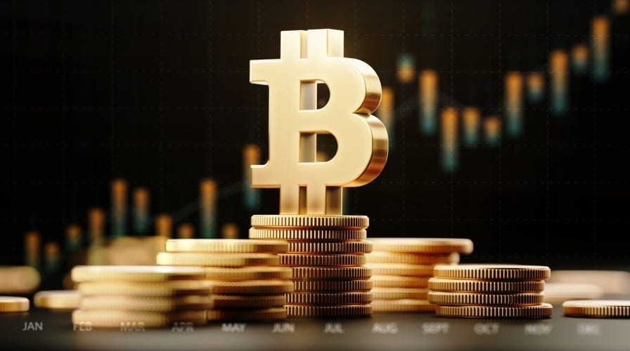 Bitcoin tops $1T for first time amid cryptocurrency surge 