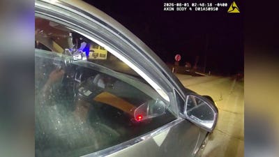 WATCH: Wild traffic stop turns chaotic as suspect drives off with one cop inside, drags second officer