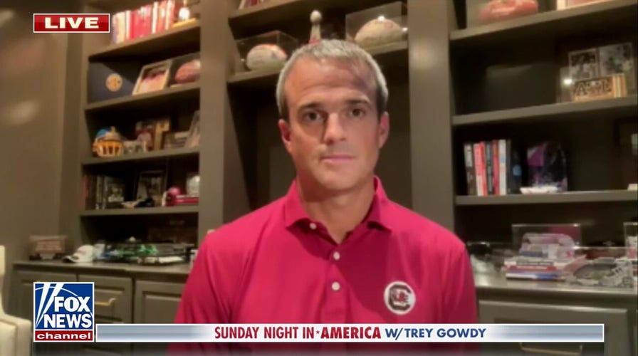 Football coach surprises walk-on with scholarship 