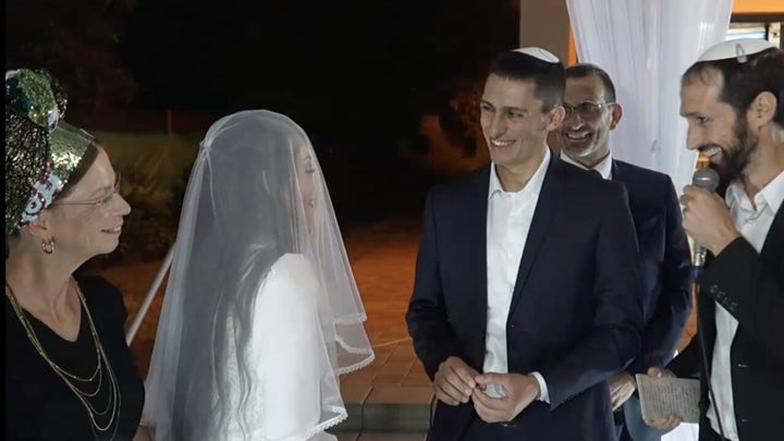 Israeli soldier celebrates wedding days after he's shot and his brother goes missing in action
