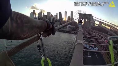 Police pull woman to safety atop Brooklyn Bridge after tense rescue operation