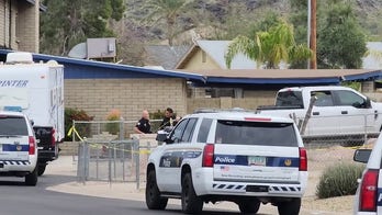 Phoenix police at home where authorities found three bodies in alleged homicide