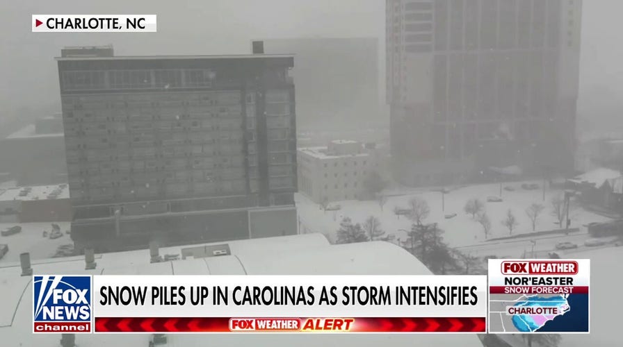 Thousands of US flights disrupted by nor’easter as snow piles up in Carolinas