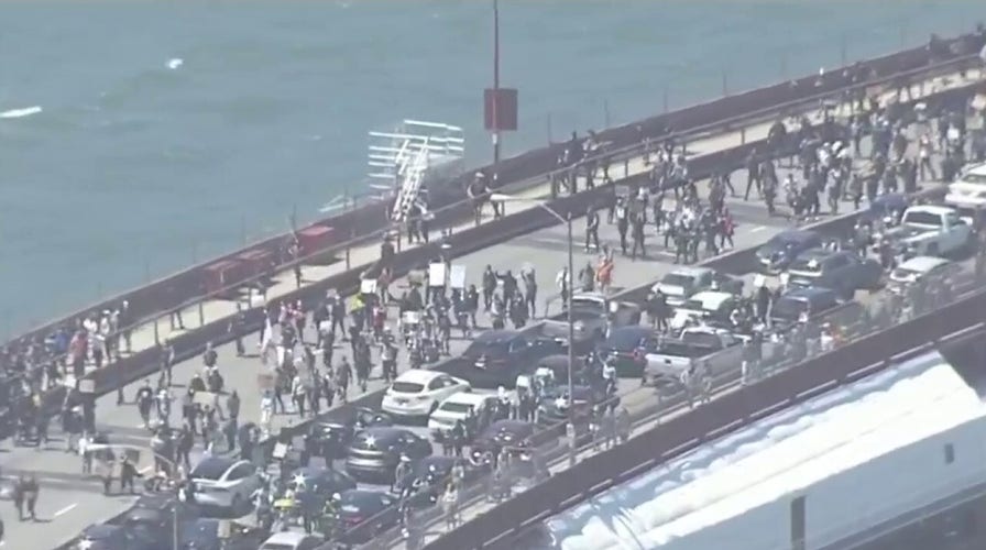 Hundreds march across Golden Gate Bridge in San Francisco protest