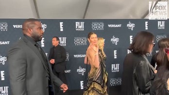 Jessica Biel walks the red carpet at the Critics Choice Awards