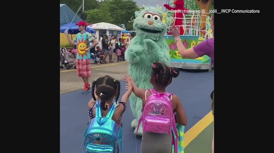 Sesame Street character ignores two children at park