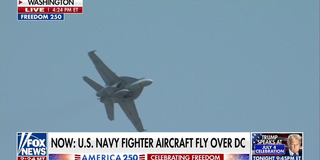 US Navy fighter aircraft fly over Washington, DC, in America 250 celebration