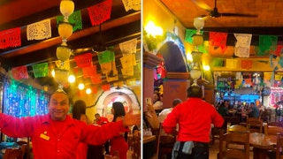 Waiter dances through restaurant balancing 4 frozen margaritas on his head