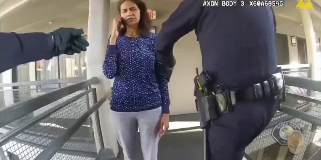 Body camera footage shows a mother with 'blood on her hands' as police arrest her for allegedly killing her young son