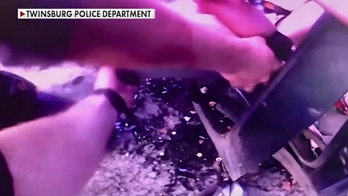 Ohio officer crawls into car wreckage to rescue trapped child, bodycam video shows