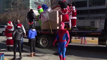 Chicago boy, 5, who is recovering from shooting, is surprised with Christmas gifts from costumed characters
