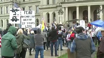 Whitmer's stay-at-home orders protested outside Michigan Capitol as scuffle breaks out