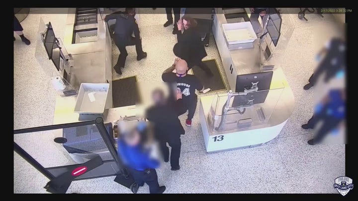 Salt Lake City police officer assaulted at airport, bystander helps subdue suspect, video shows