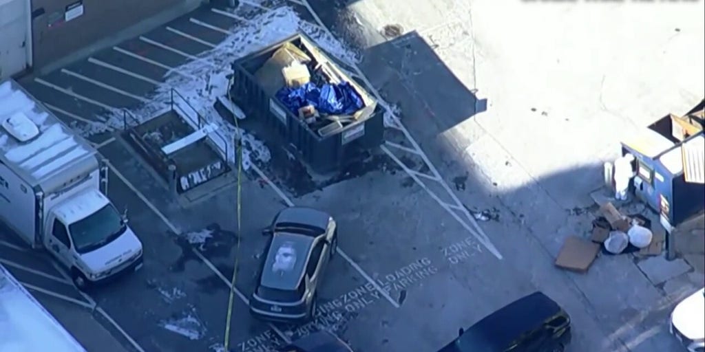 Investigators examine a dumpster near Brown University shooting