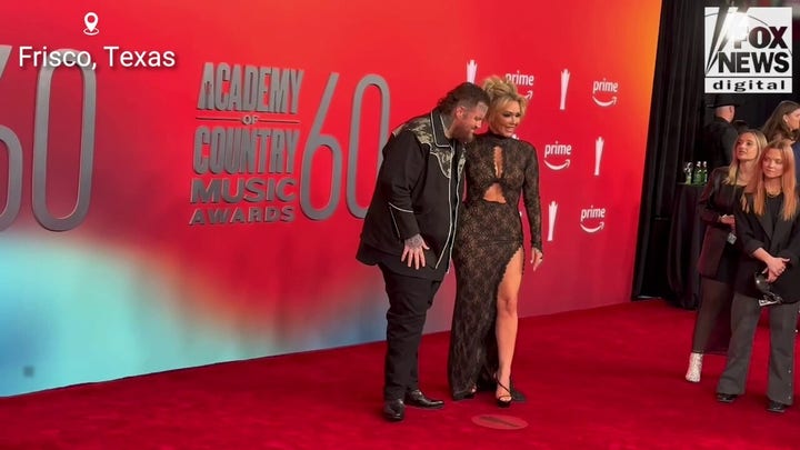 Jelly Roll and Bunnie XO walk the red carpet together at the 2025 ACM Awards