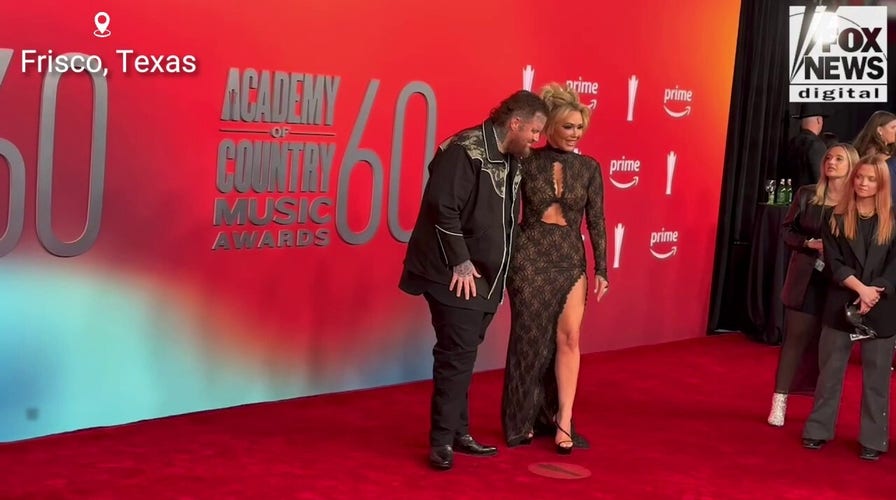 Jelly Roll and Bunnie XO walk the red carpet together at the 2025 ACM Awards