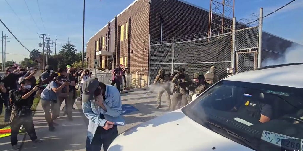 WATCH: ICE protesters thrown to ground by law enforcement as they attempt to block vehicle