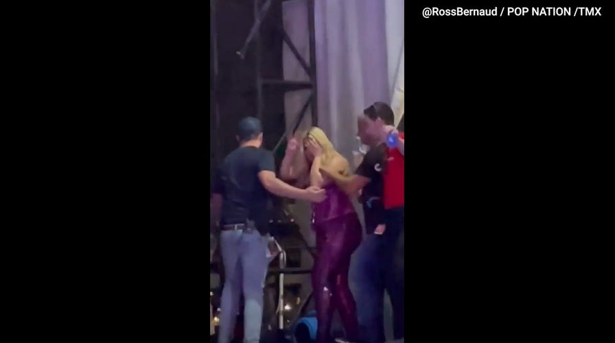 Bebe Rexha waves to fans after being hit with cell phone