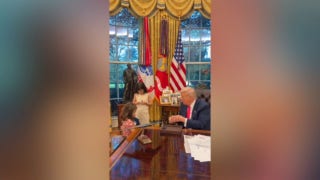 Trump greets children in Oval Office, offers mementos: 'My name is Donald'