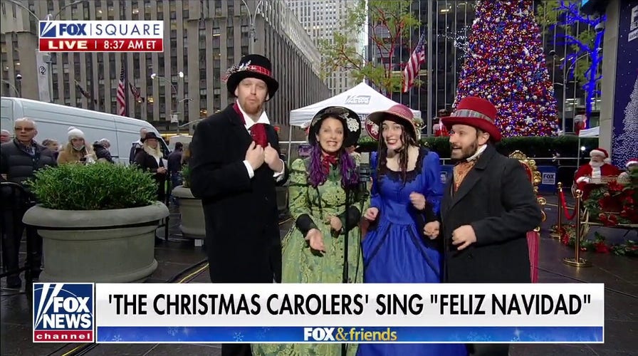 The Christmas Carolers perform 'Feliz Navidad' on Fox Square