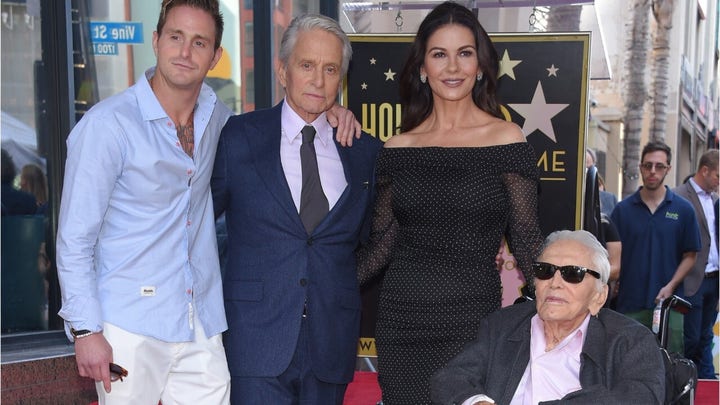 Kirk Douglas' daughter-in-law Catherine Zeta-Jones reacts to his death