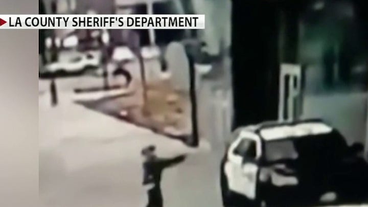 Los Angeles sheriff's deputies fight for their lives after ambush