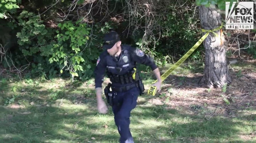 Investigators search for evidence in the Charlie Kirk assassination