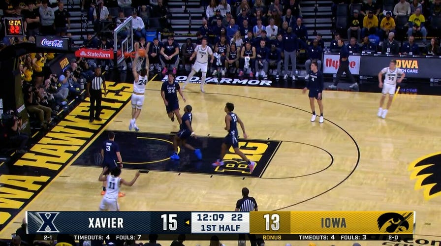 Iowa's Tate Sage cuts up the mediate for a two-handed slam vs. Xavier
